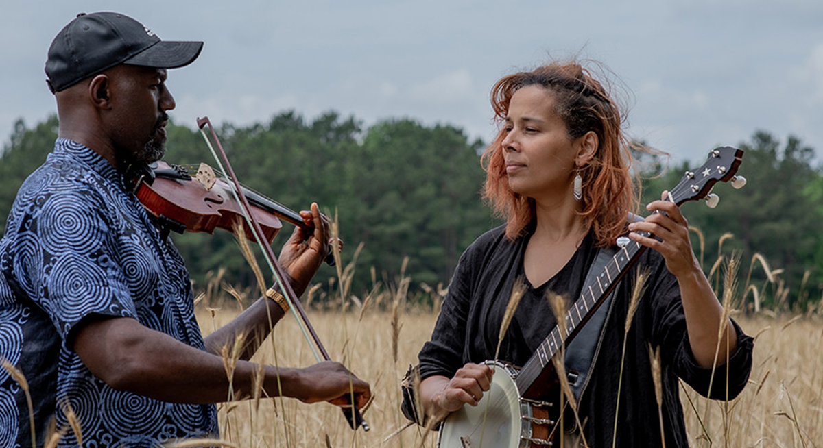 Photo of Rhiannon Giddens and Justin Robinson